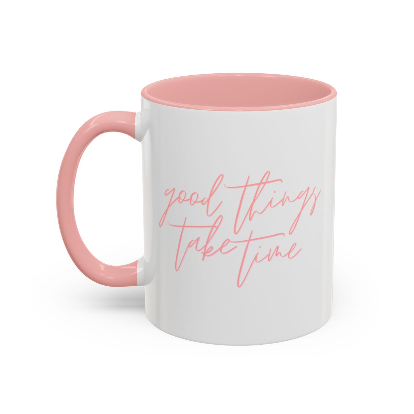 White mug with pink interior and handle, featuring the text 'good things take time' on a white background.