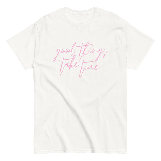 White t-shirt with pink text 'good things take time' on a white background